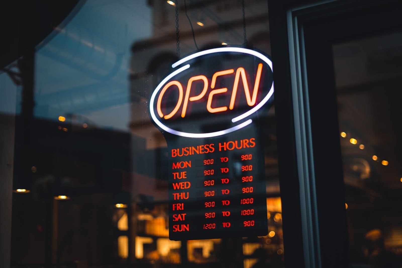 Entrepreneur updating business hours on Google Business Profile dashboard