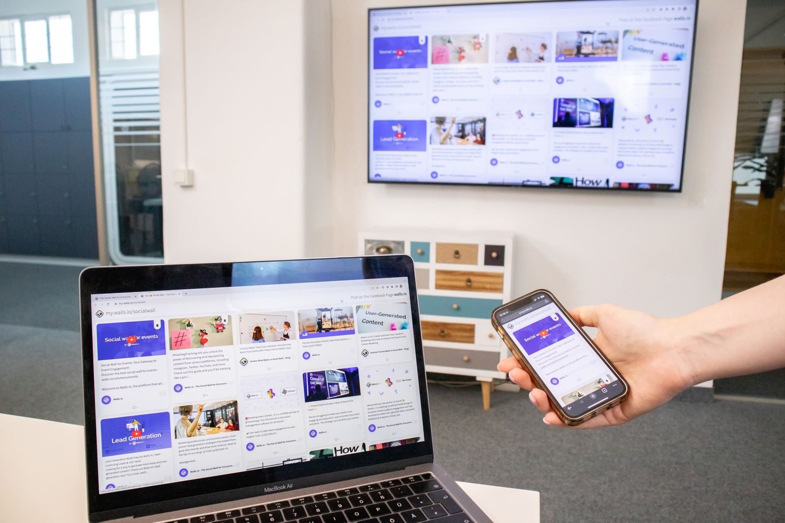 Business owner viewing website, Google Business Profile, and social media together on a laptop