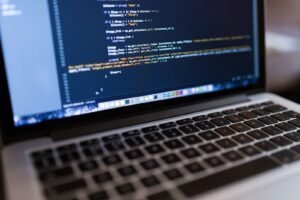 Business owner reviewing website design cost estimates on a laptop