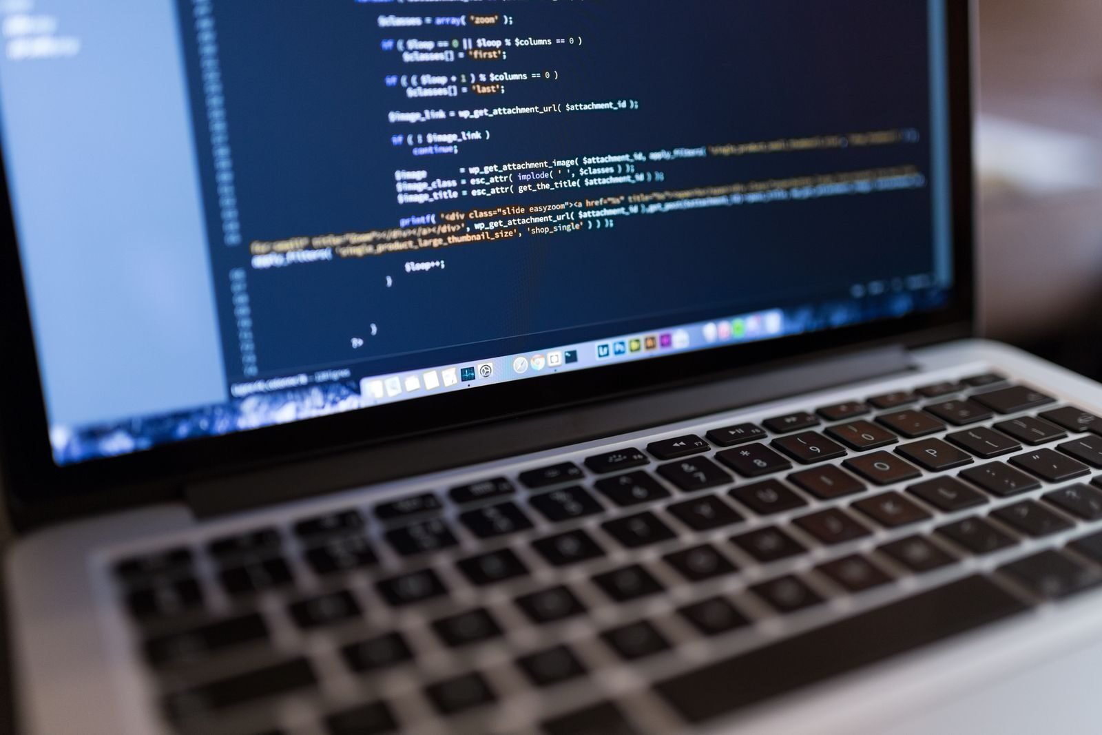 Business owner reviewing website design cost estimates on a laptop