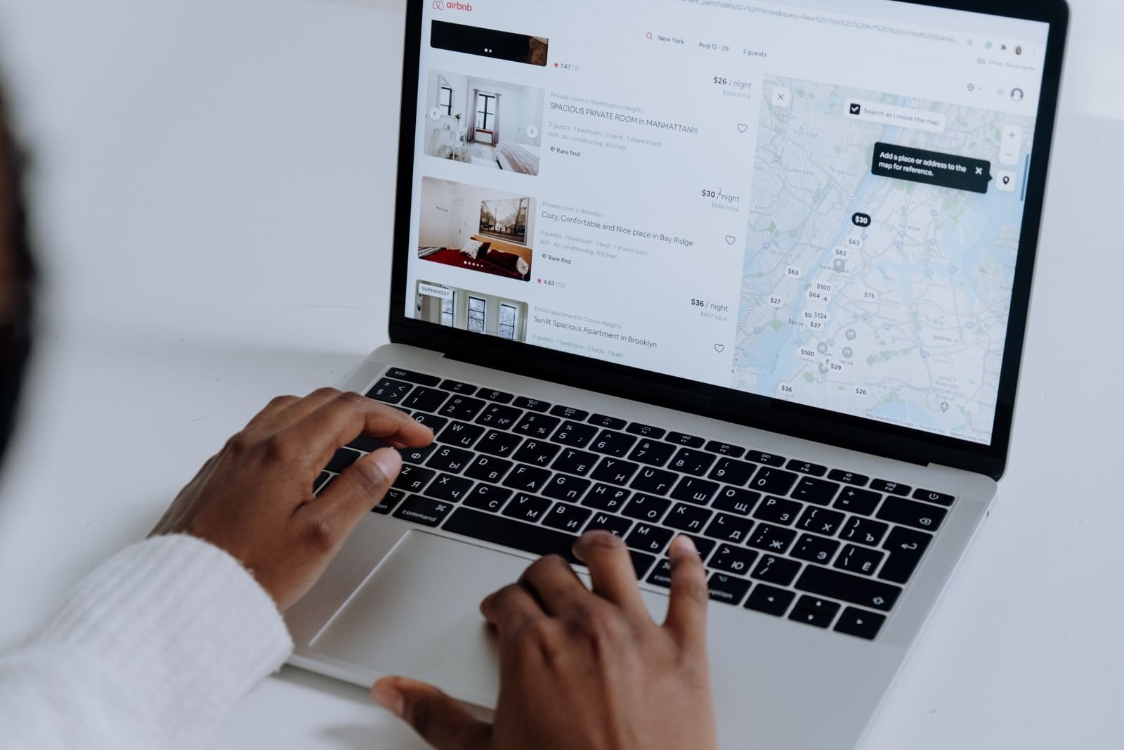Entrepreneur reviewing Google Business Profile insights dashboard on laptop