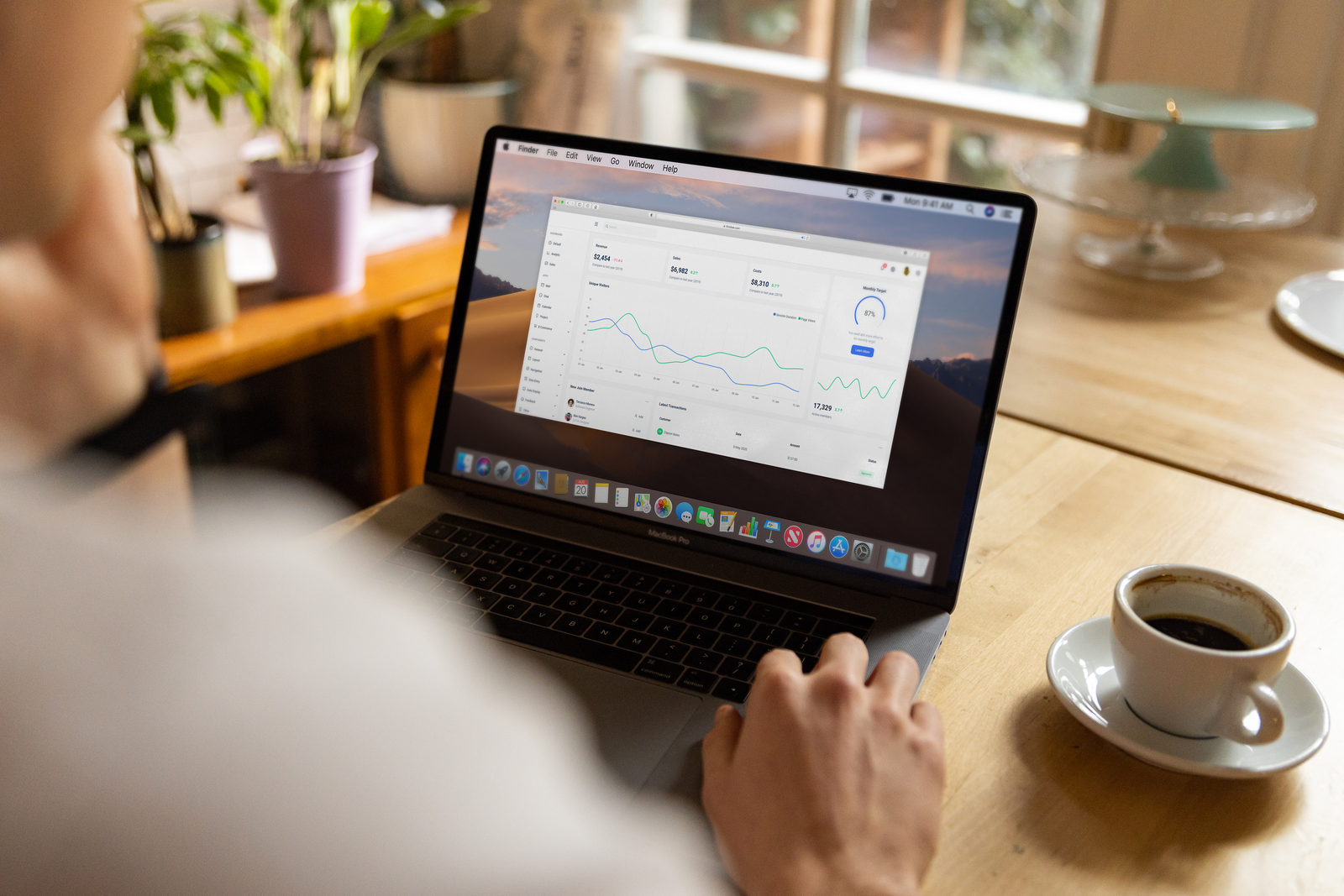 Business owner reviewing website analytics dashboard on a laptop