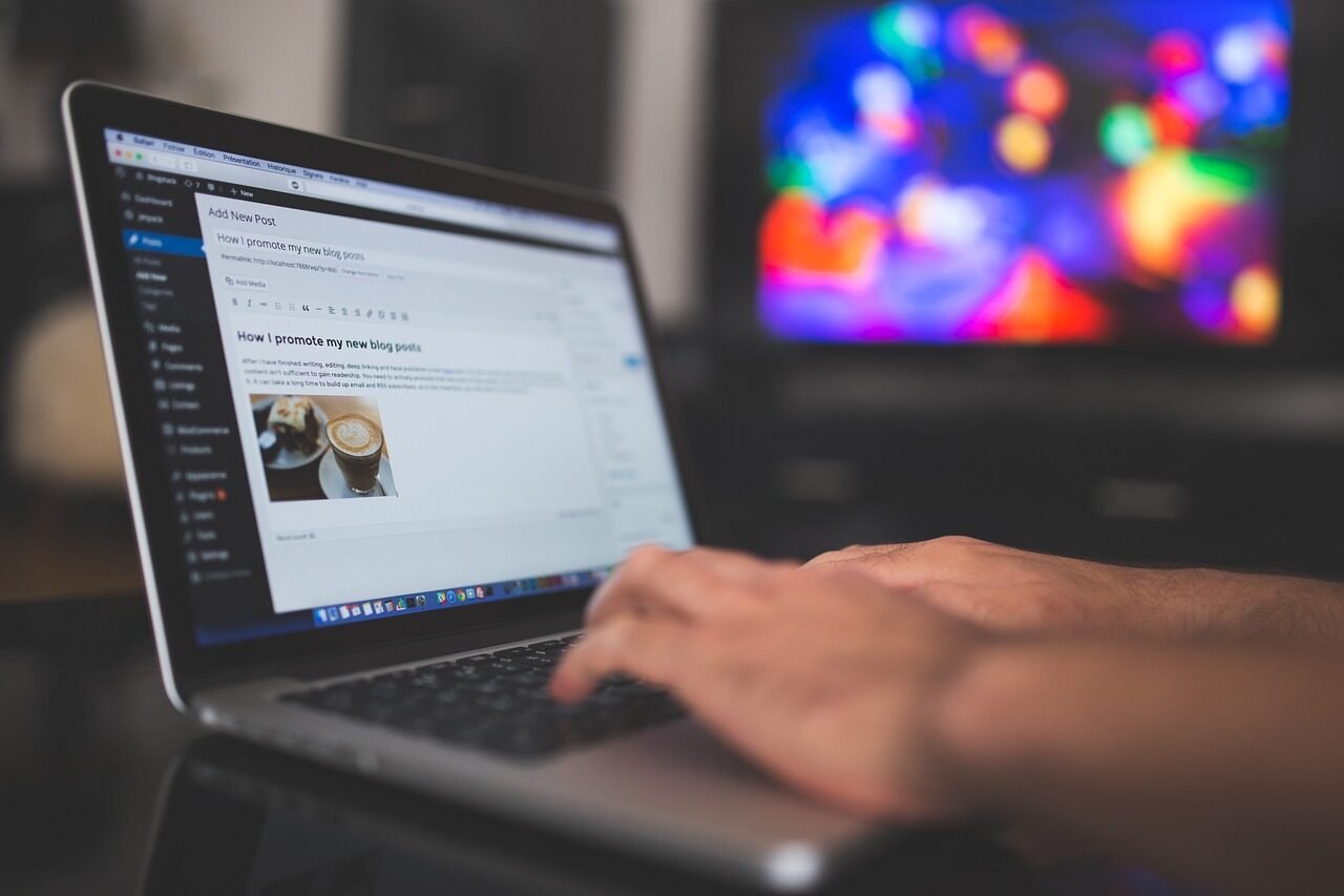 Entrepreneur reviewing website conversion data on a laptop