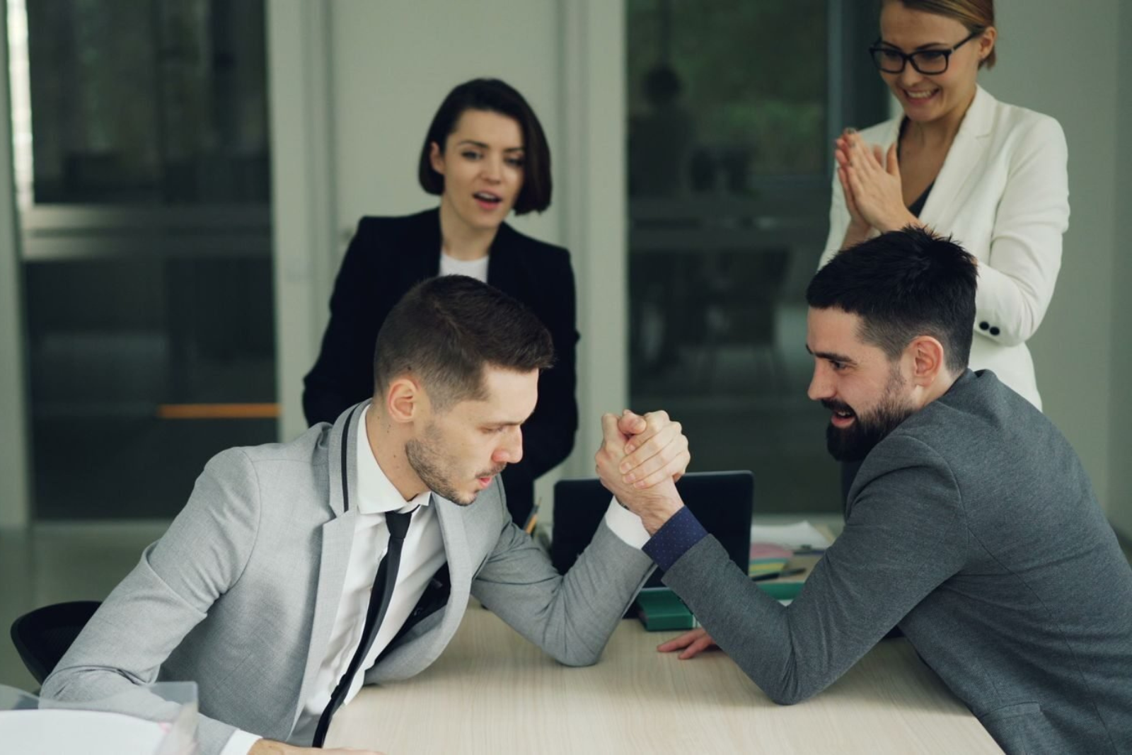 Entrepreneur reviewing competitor websites for market research