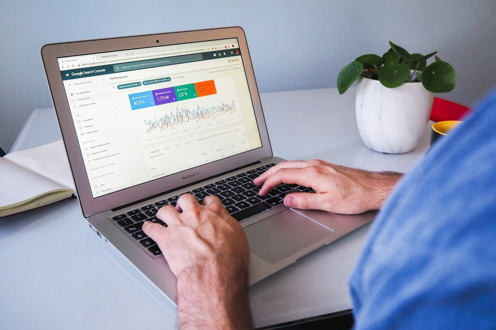 Entrepreneur reviewing website SEO settings on a laptop