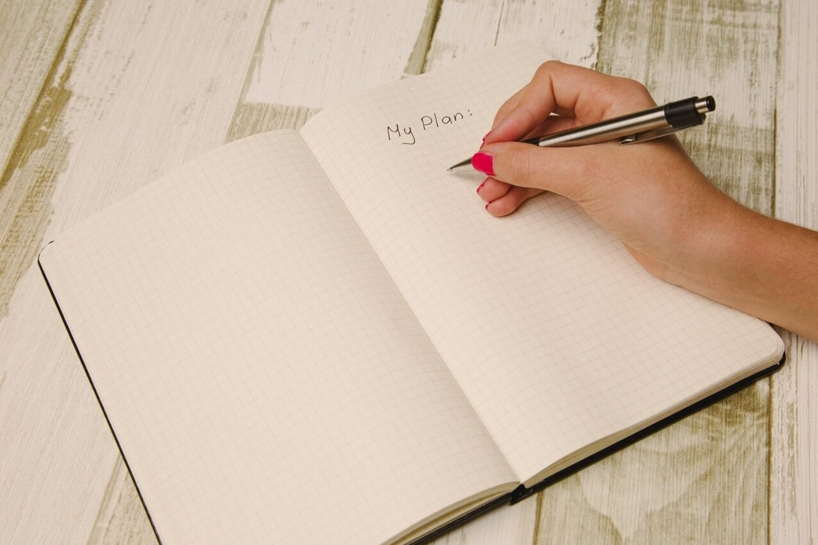 Entrepreneur planning social media content in advance on a calendar