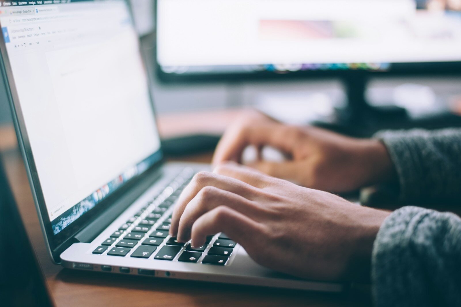 Business owner reviewing a negative customer review on a laptop