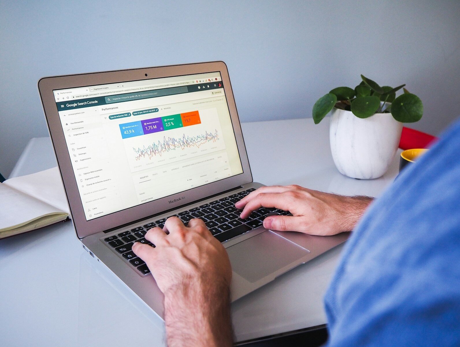 Entrepreneur reviewing website SEO settings on a laptop